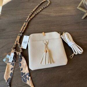 Pretty, new ivory crossbody purse with interchangeable straps